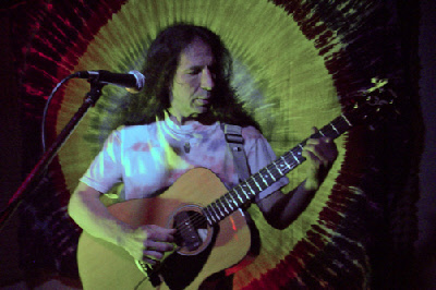 Dave Treen performing with an acoustic guitar