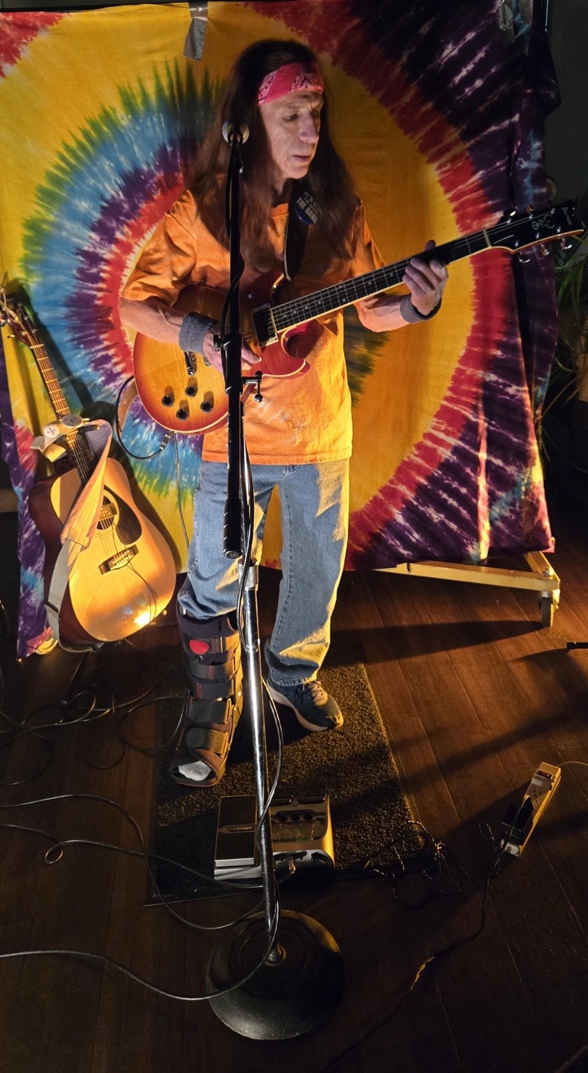 Dave Treen performing guitar